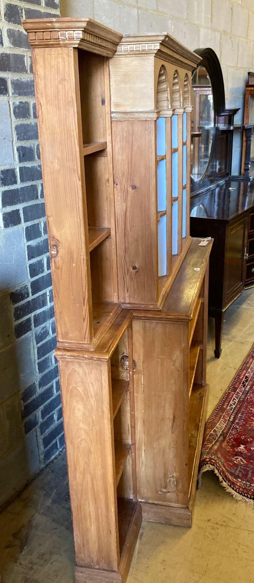 A pine breakfront open bookcase, width 172cm height 176cm